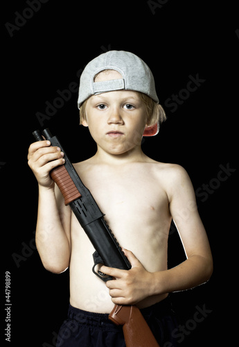 Bild auf Leinwand Bad boy with toy gun