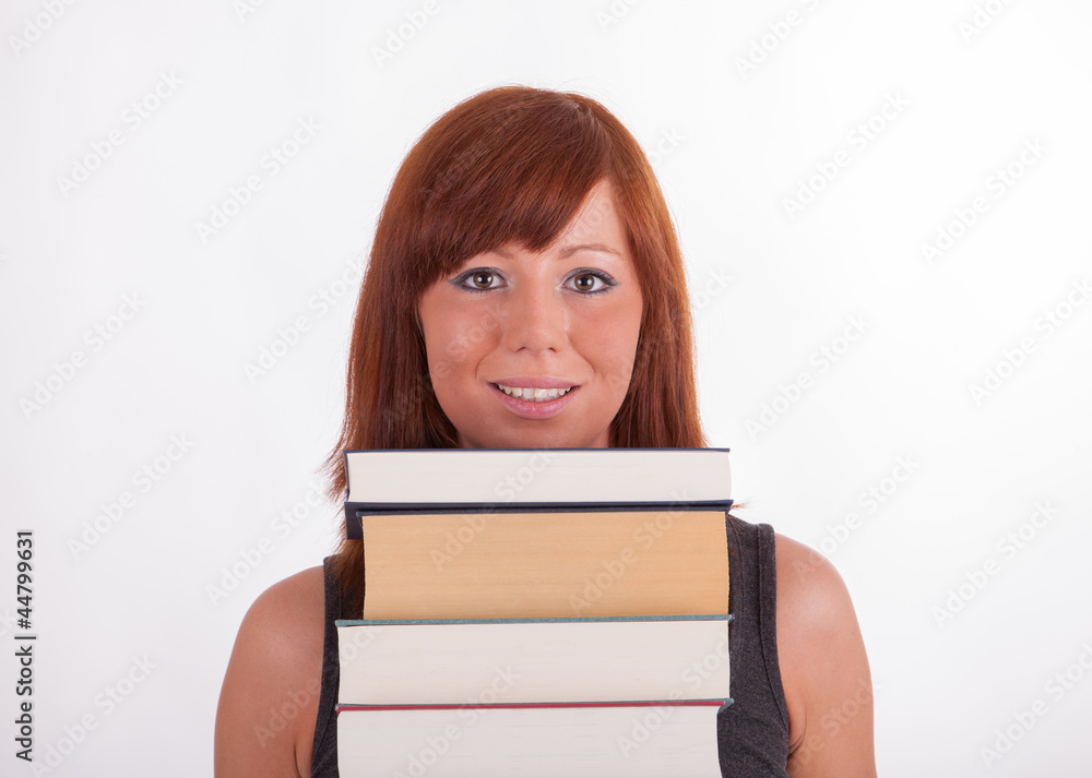 Eine junge schöne Frau trägt viele Bücher Eine junge schöne Frau trägt viele Bücher