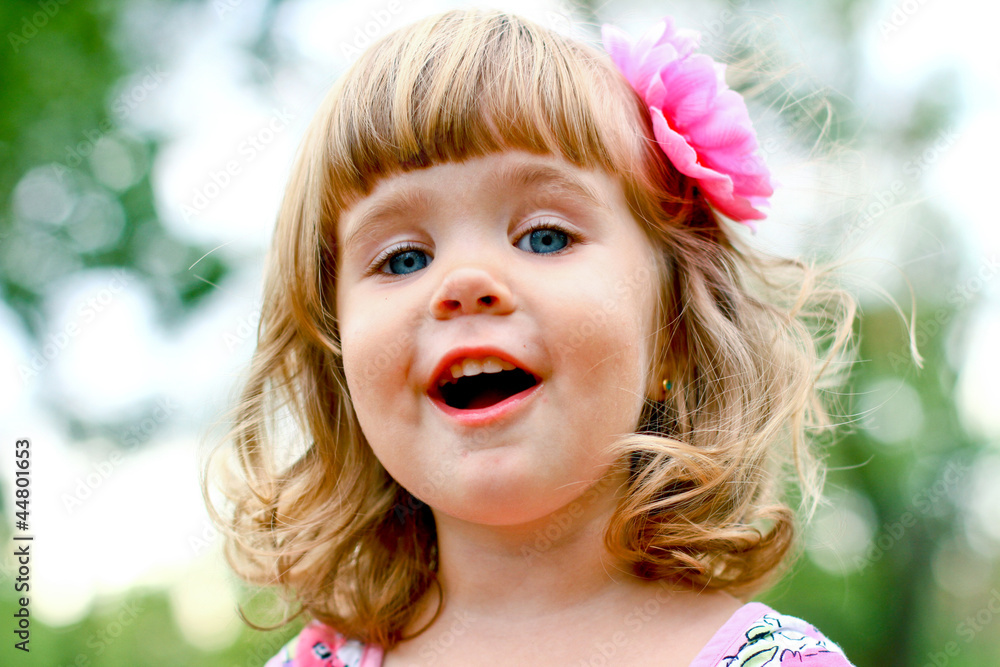Caucasian little girl walking in the park Caucasian little girl walking in the park