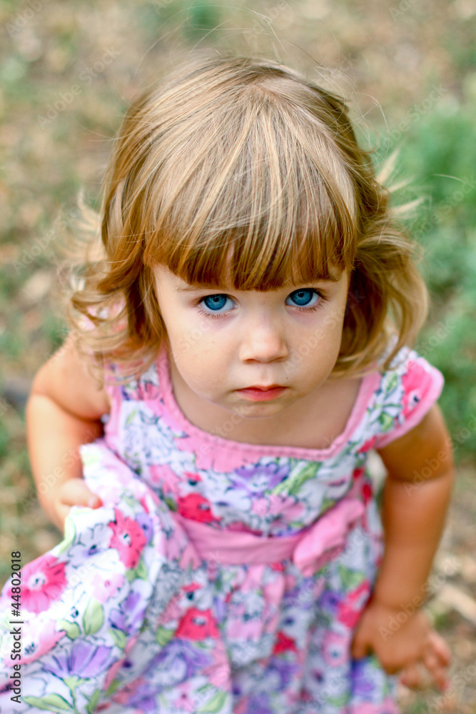 Caucasian little girl walking in the park Caucasian little girl walking in the park