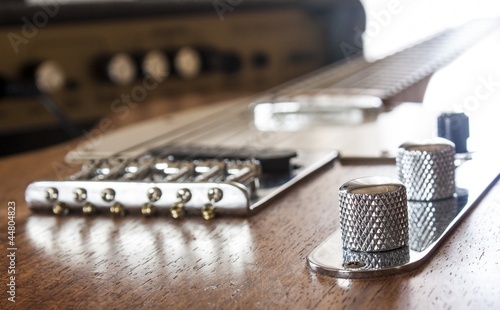 guitar and amp with window light on back