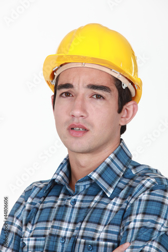 Builder with confused look on face