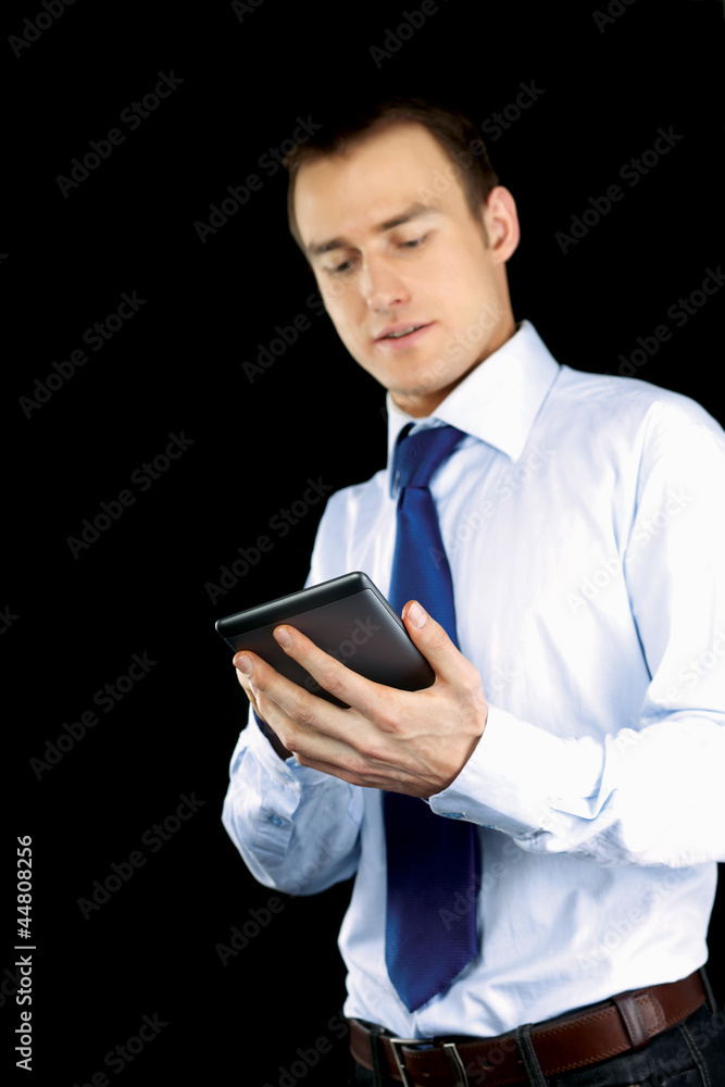 Handsome businessman using computer plane-table Handsome businessman using computer plane-table