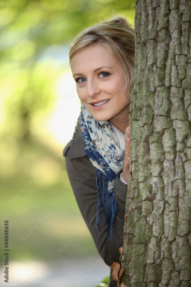 Blond stood behind tree Blond stood behind tree