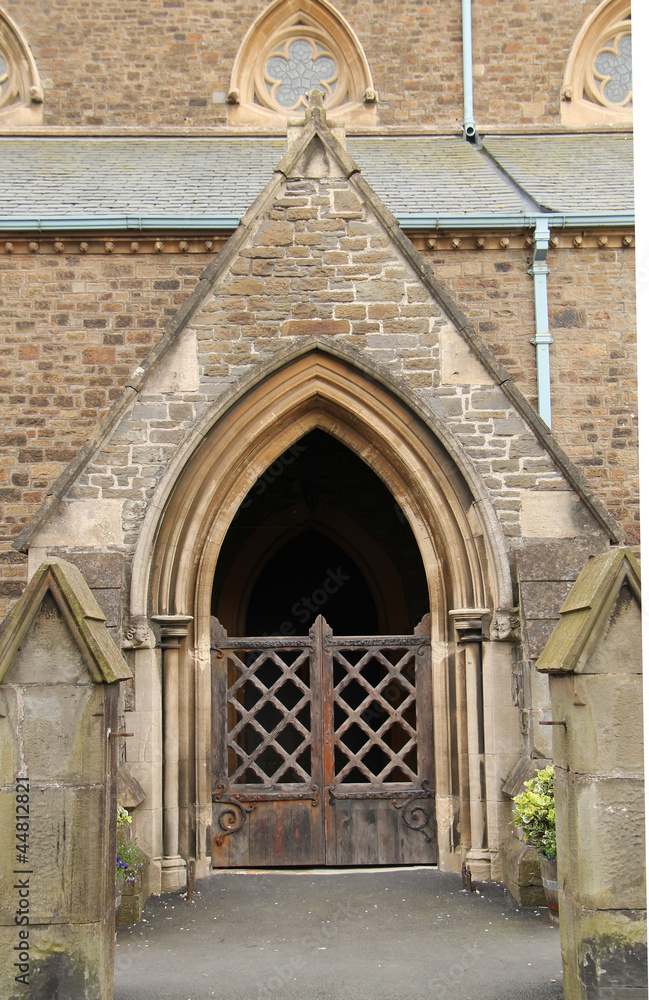 The Wooden Gates to a Church Stone Doorway. The Wooden Gates to a Church Stone Doorway.