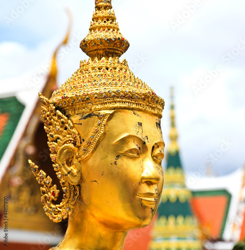 Golden kinnara statue in Gr...