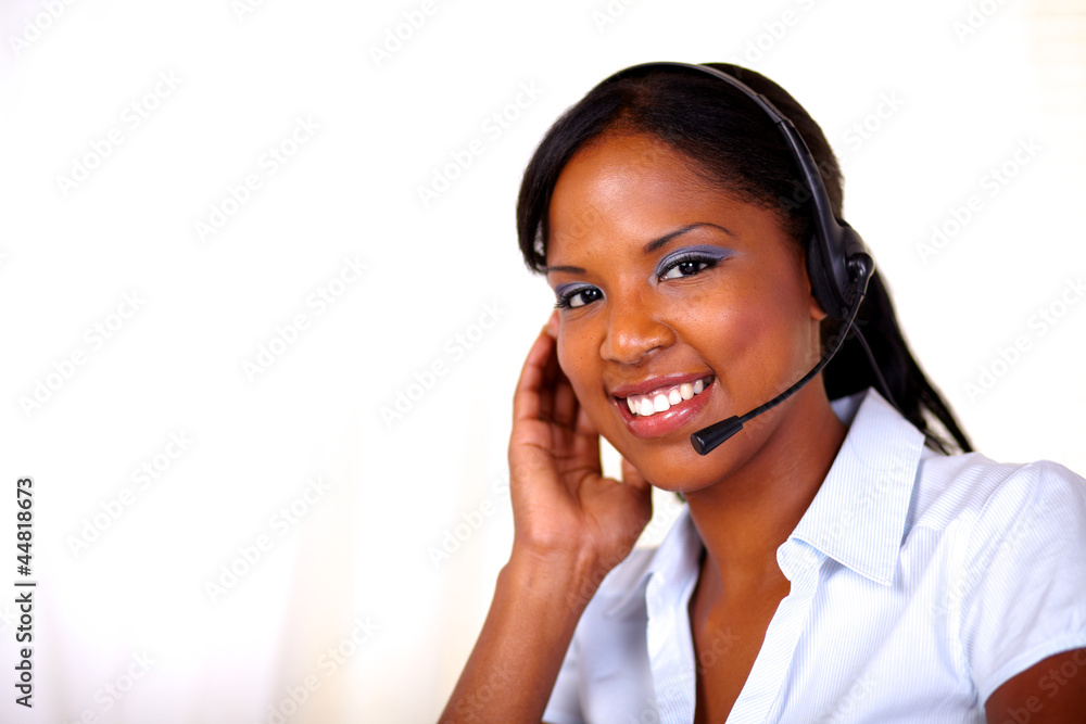 Attractive receptionist smiling and looking at you Attractive receptionist smiling and looking at you