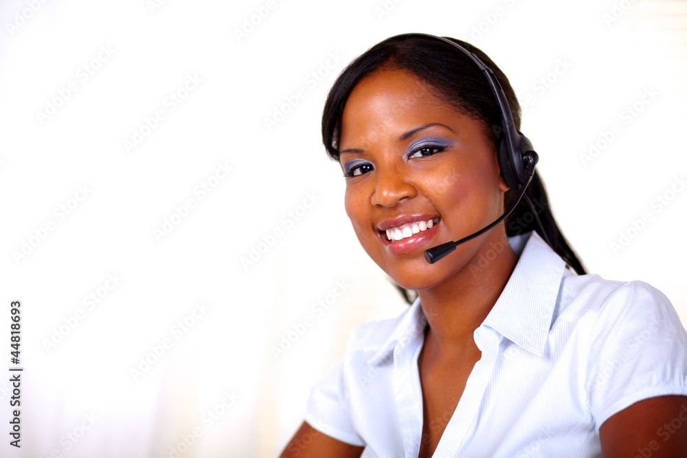 Beautiful receptionist smiling and looking at you Beautiful receptionist smiling and looking at you