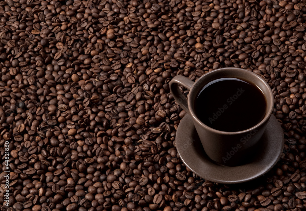 Coffee cup on coffee beans Coffee cup on coffee beans
