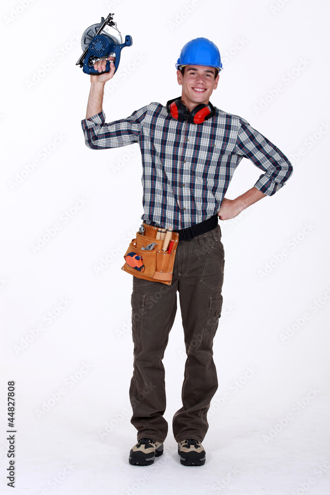 Young construction worker with a circular saw Young construction worker with a circular saw