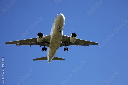 Airplane in the blue sky