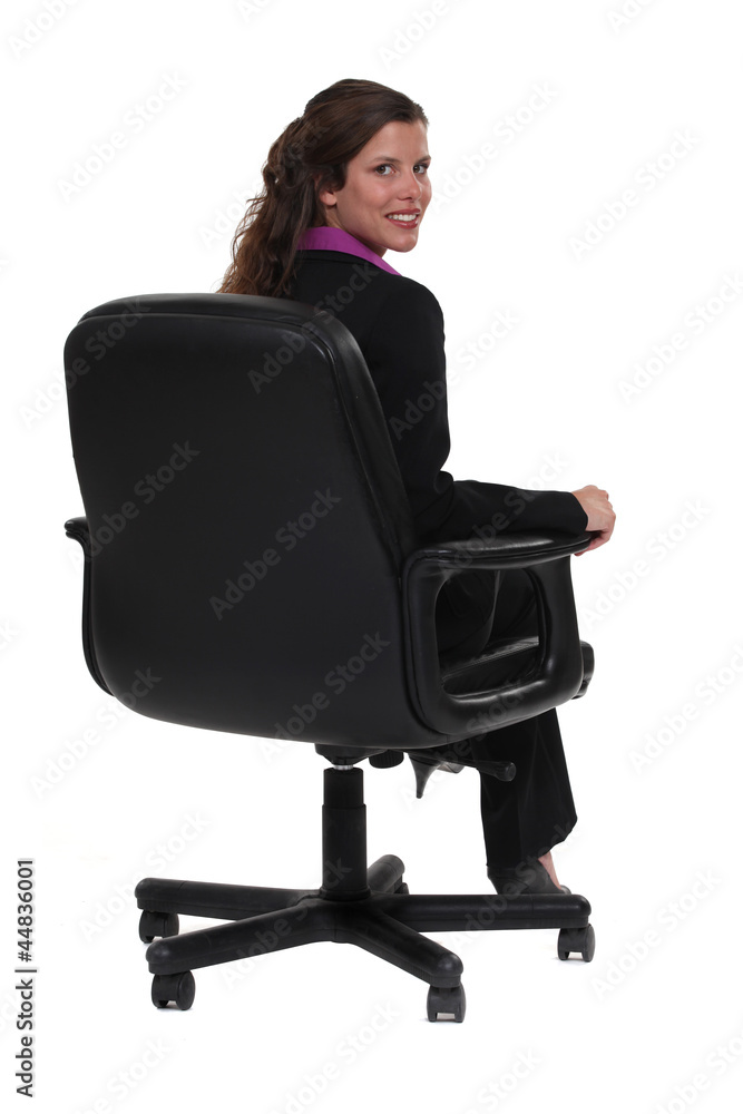 Business professional sitting in a swivel chair Business professional sitting in a swivel chair