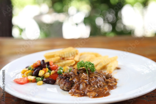 Grilled Porkchop on wood background