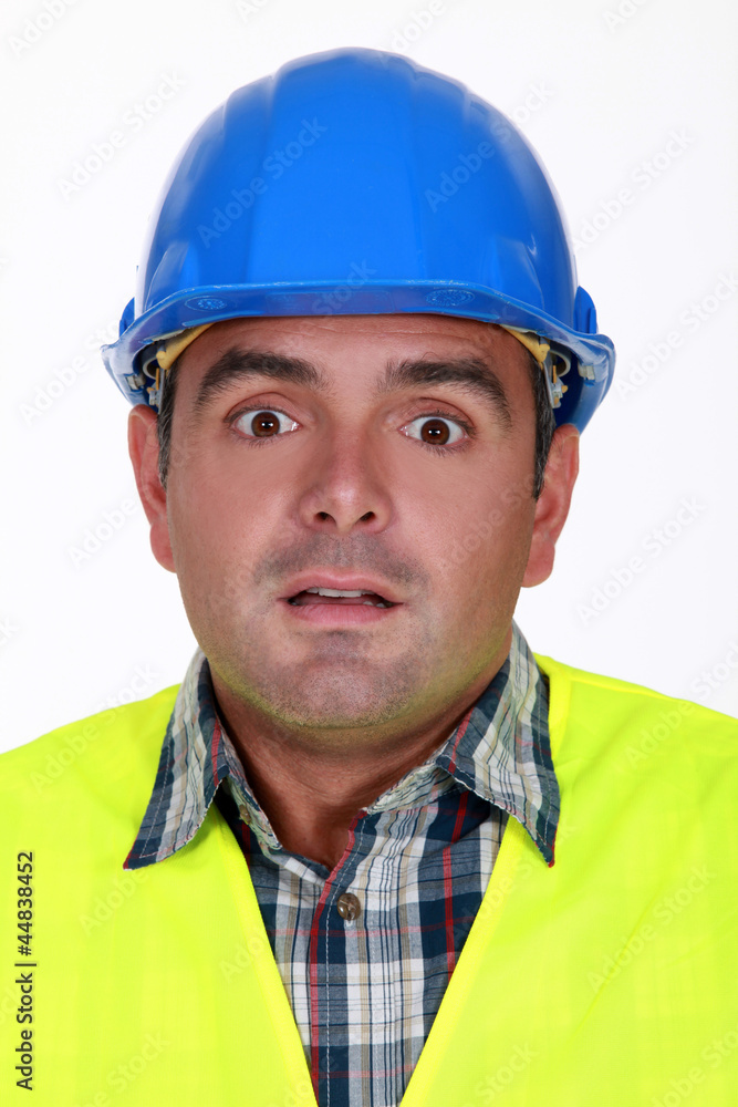 Alarmed construction worker Alarmed construction worker