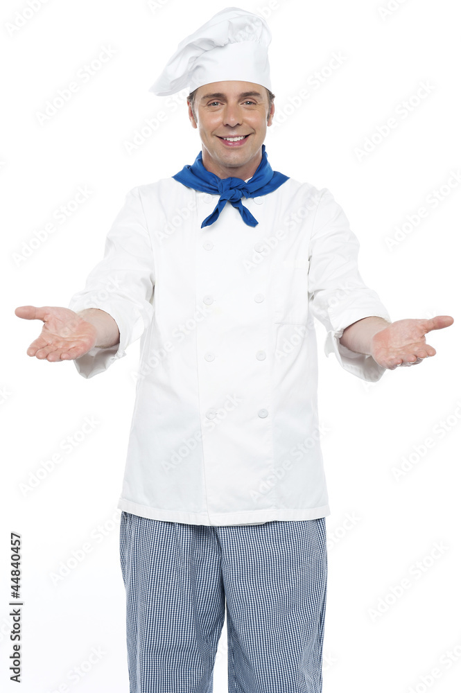 Smiling chef posing with his arms wide open Smiling chef posing with his arms wide open