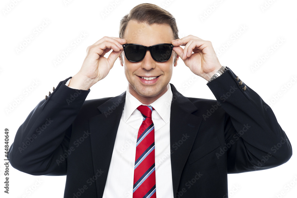 Stylish handsome businessman wearing shades Stylish handsome businessman wearing shades