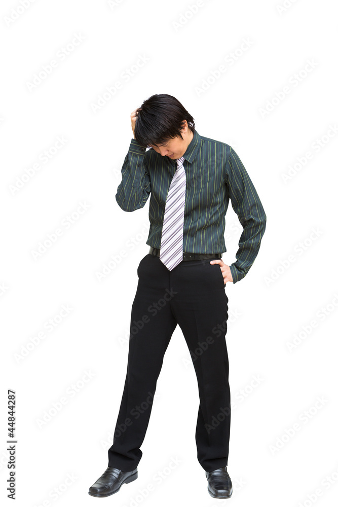 Young business man holding his head in pain against Young business man holding his head in pain against