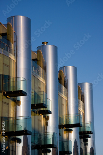Modern architecture -a building with balconies and silver tubes