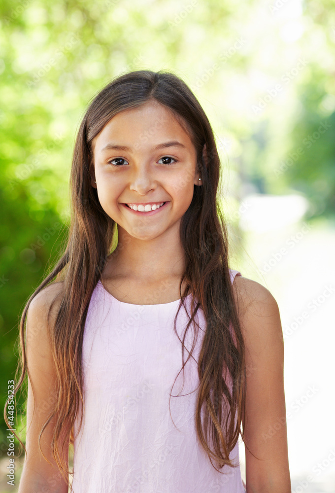 portrait of the girl standing in the shade of a tree portrait of the girl standing in the shade of a tree