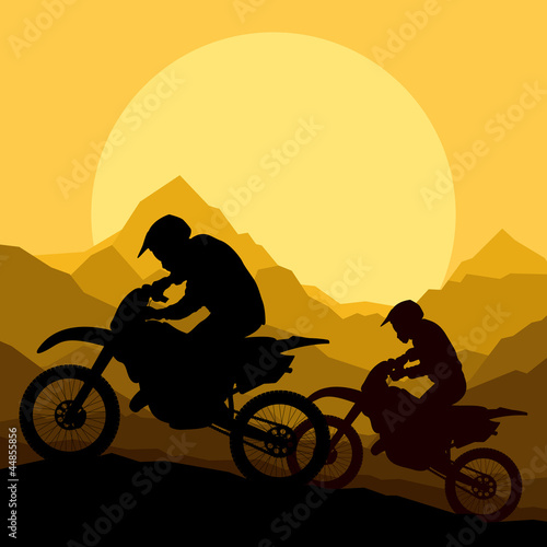 Motorbike riders motorcycle silhouettes in wild mountain landsca