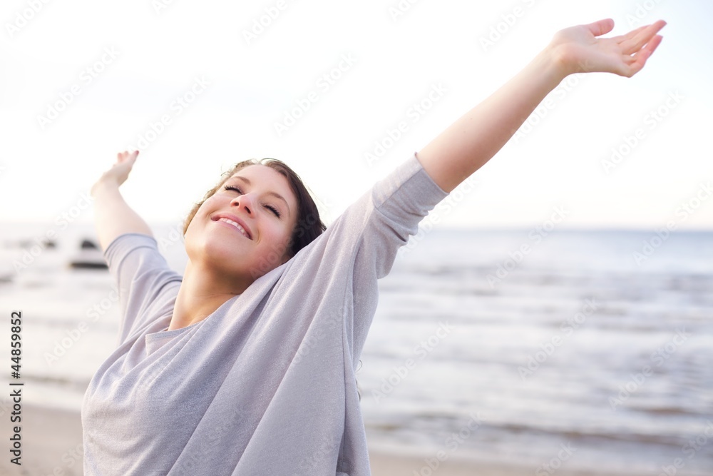 Woman Enjoying the Fresh Air of the Sea