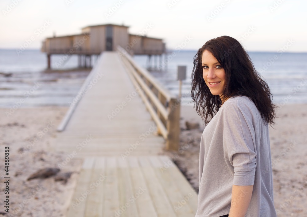Woman on an Idyllic Beach Facing the Camera