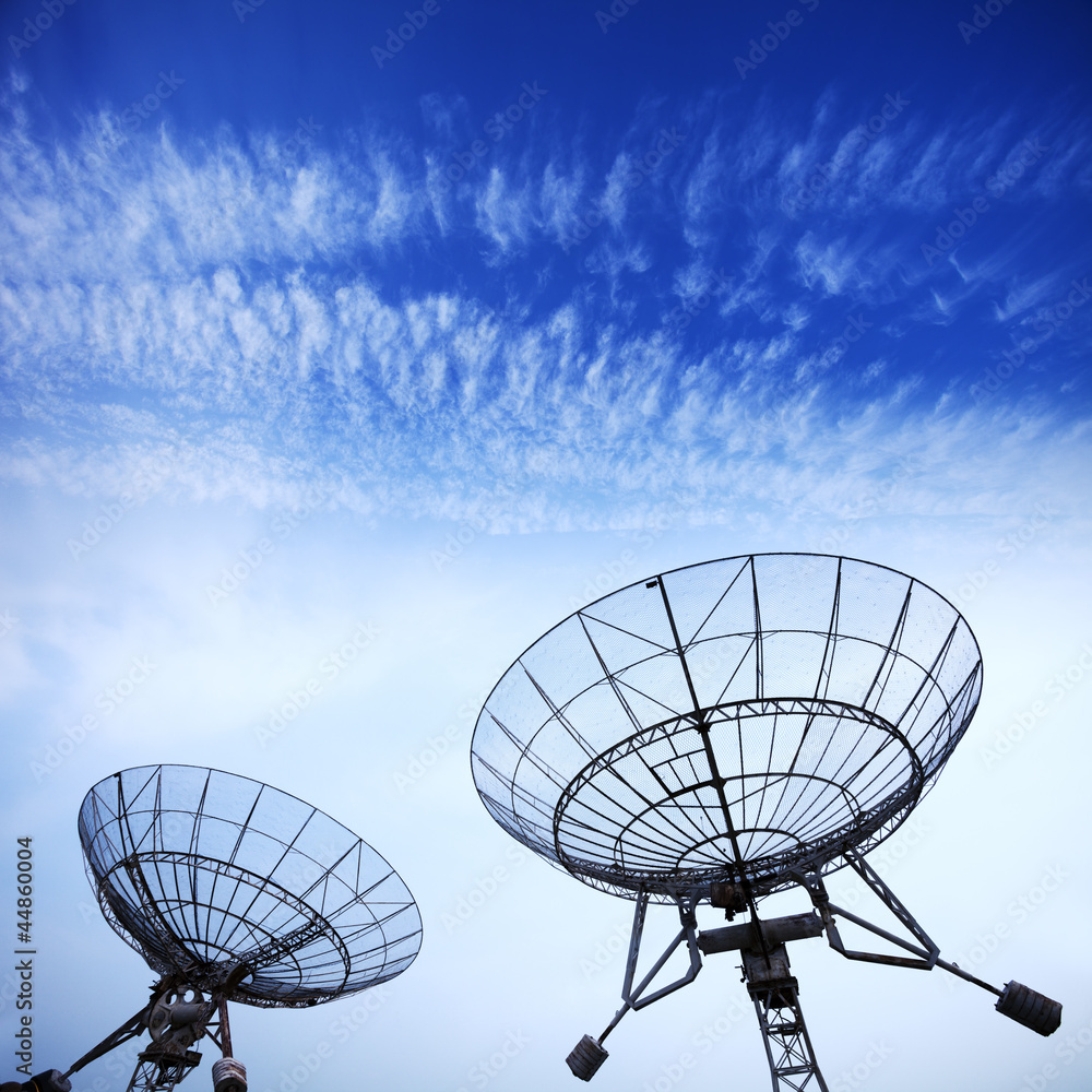 satellite dishes with blue sky