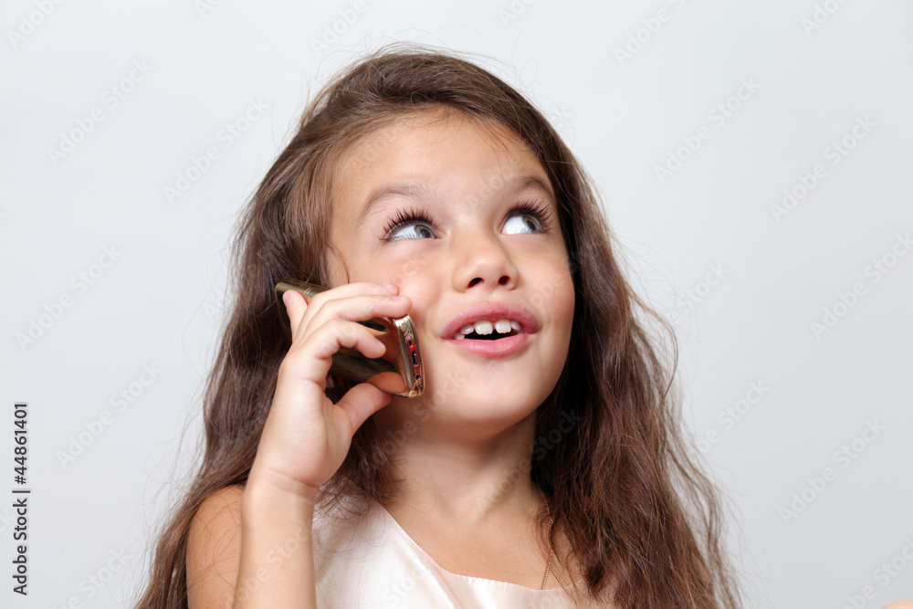 Fototapeta premium little girl calling by phone