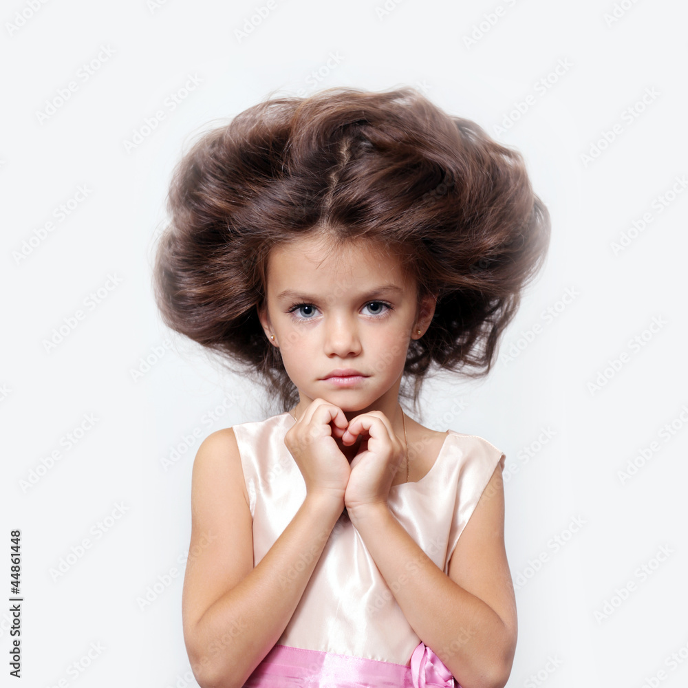portrait of little girl with extravagant hair on his head portrait of little girl with extravagant hair on his head