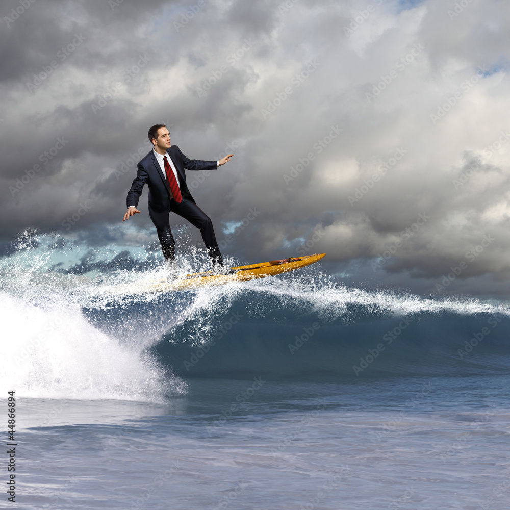 Young business person surfing on the waves Young business person surfing on the waves