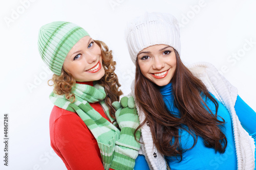 Young woman wearing winter hat and warm scarf