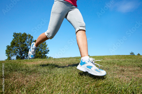 Jogging woman feet.