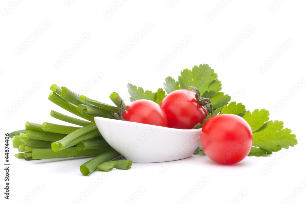Spring onions and cherry tomato in bowl Spring onions and cherry tomato in bowl