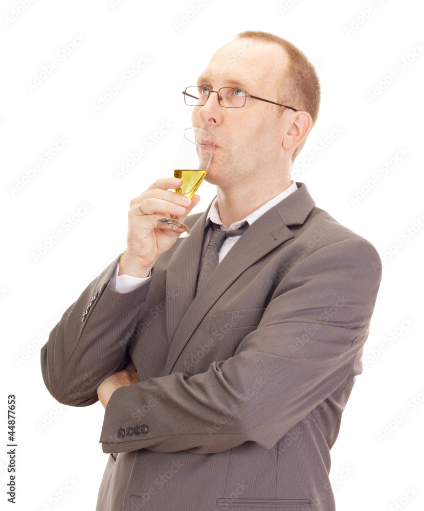 Business person drinking a glass of champagne Business person drinking a glass of champagne