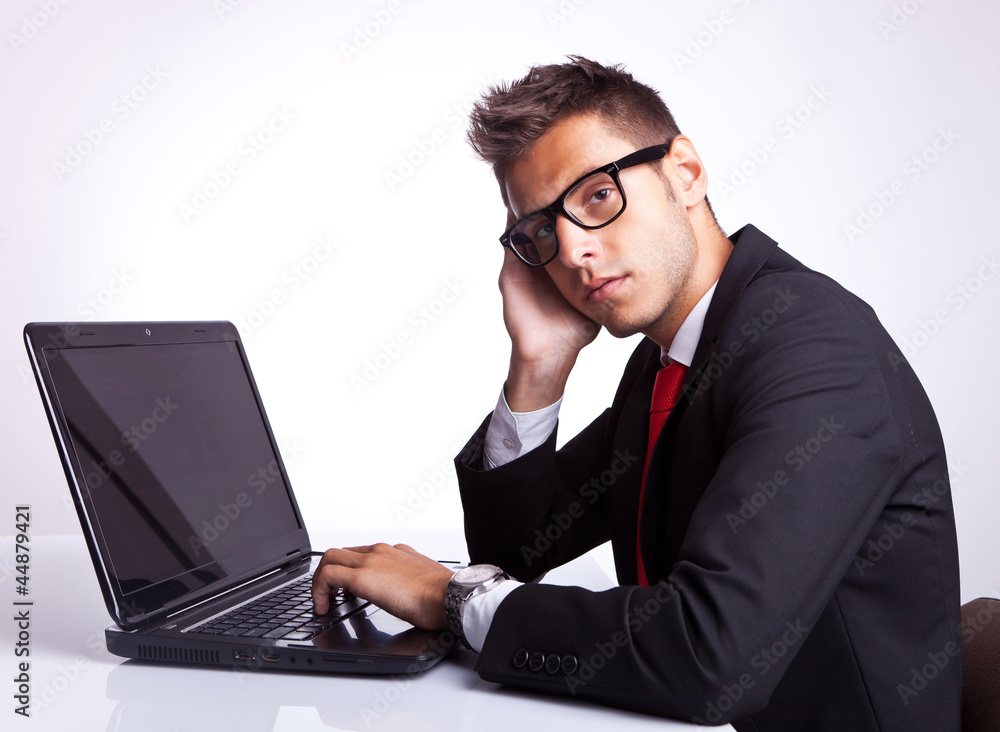 business man resting face on hand business man resting face on hand