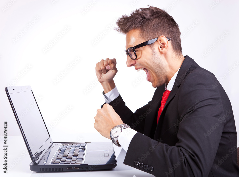 side view winning business man at work side view winning business man at work