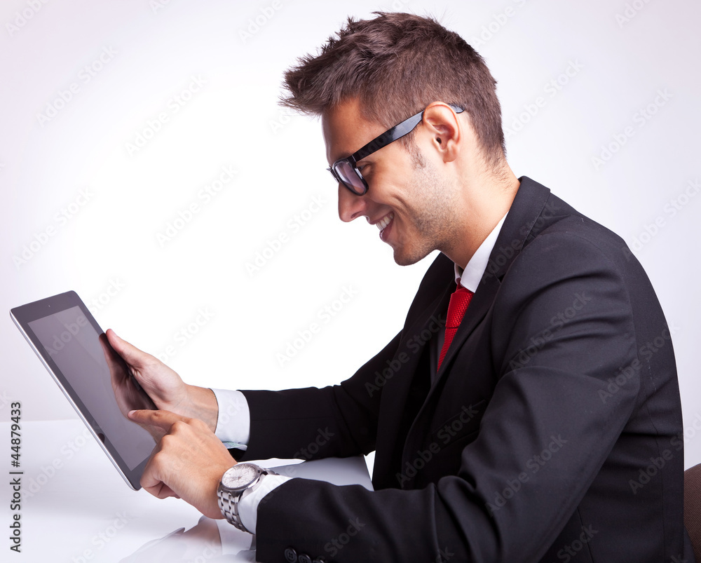 young business man browsing on his tablet pad