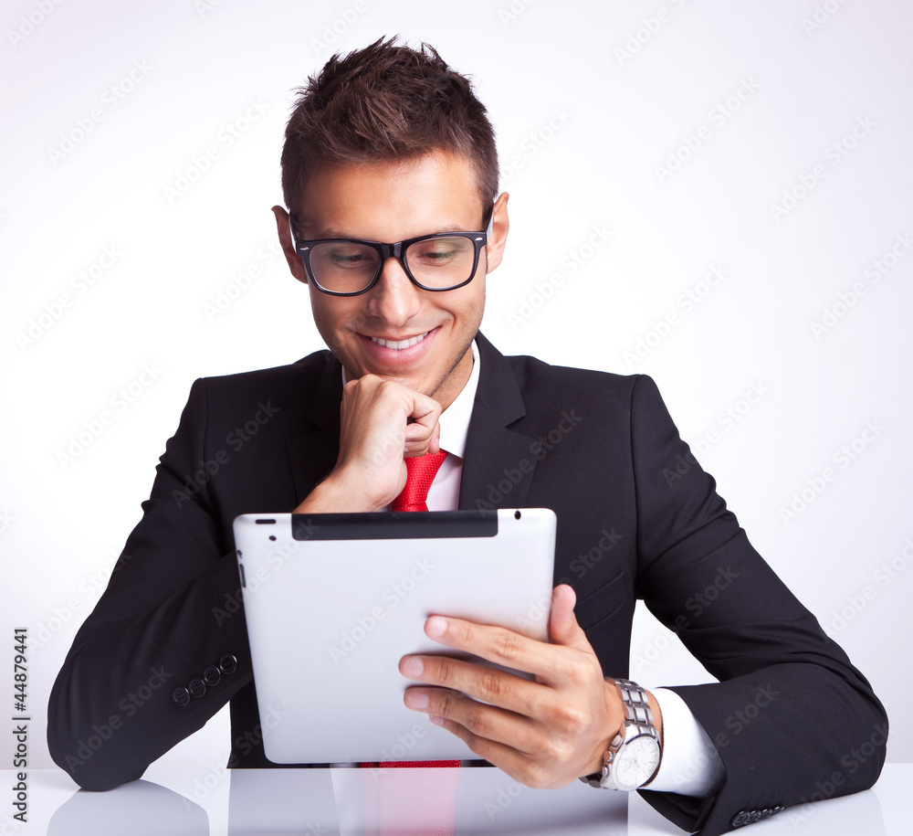 man reading interesnting stuff on his pad man reading interesnting stuff on his pad