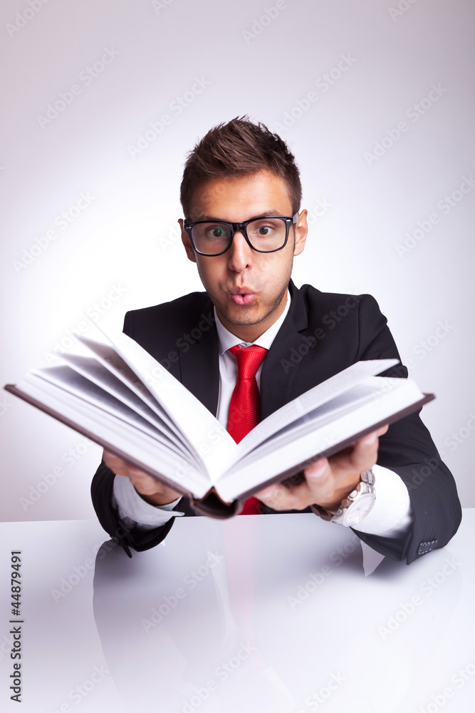 man blowing wonders from a book man blowing wonders from a book