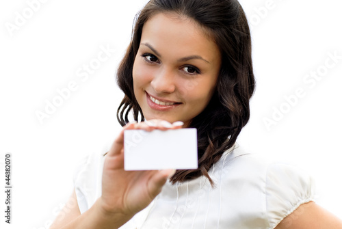 Young beautiful woman holding business card with copy space iso