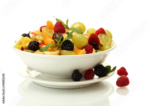 Fototapeta Naklejka Na Ścianę i Meble -  fresh fruits salad in bowl  and berries, isolated on white