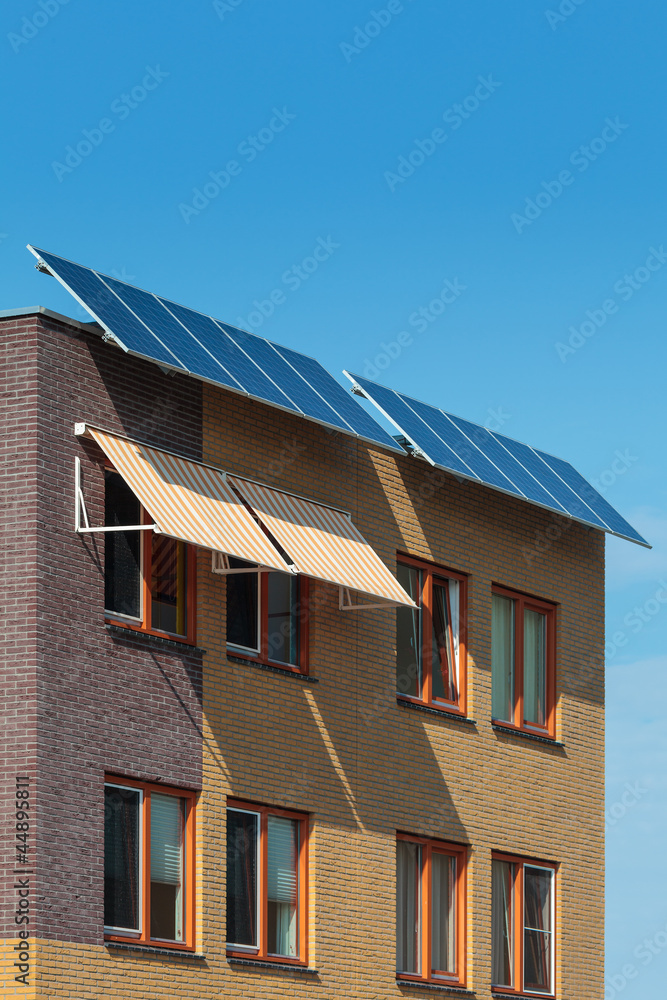 Solar panels attached on the front of a newly build house