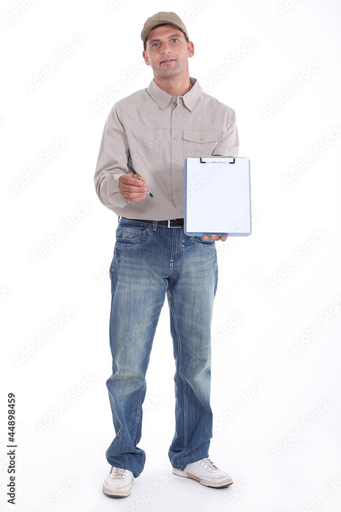 Delivery man holding up his clipboard for a signature Delivery man holding up his clipboard for a signature