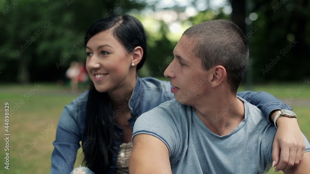 Happy teenage couple in love in the park, steadicam shot Happy teenage couple in love in the park, steadicam shot