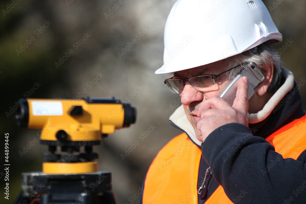 Civil engineer with surveying equipment Civil engineer with surveying equipment