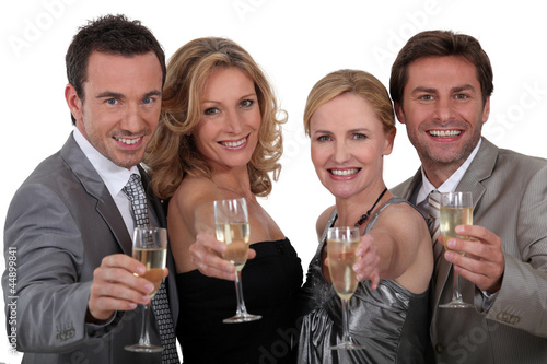 Photography Four people toasting success