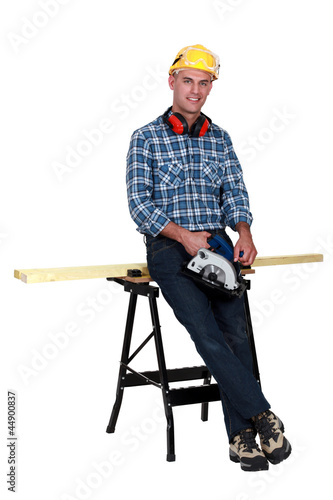 craftsman cutting a board