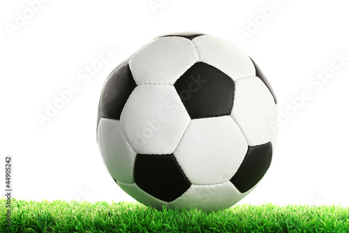 football ball on green grass, isolated on white © Africa Studio