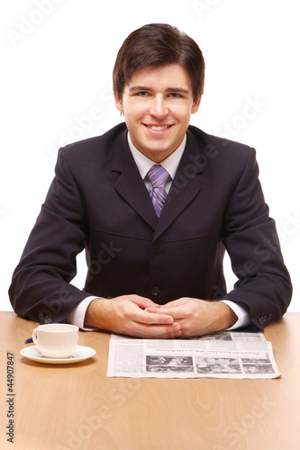 Close-up portrait of a businessman reading newspaper photo