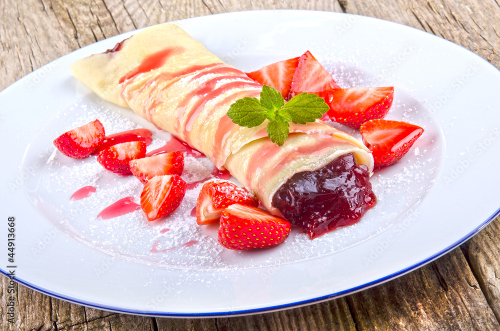 crepe with strawberries and jam crepe with strawberries and jam